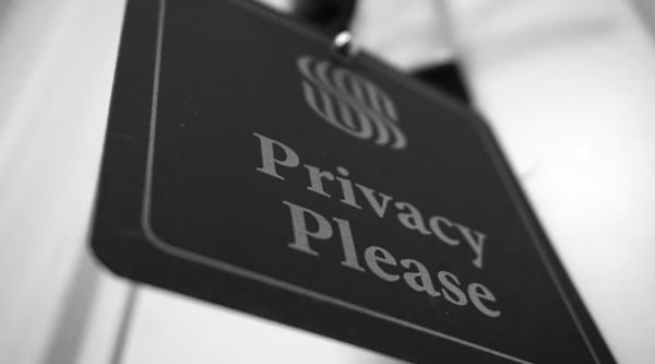 A sign that says "Privacy Please".
