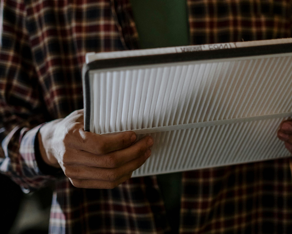 A person holding a filter