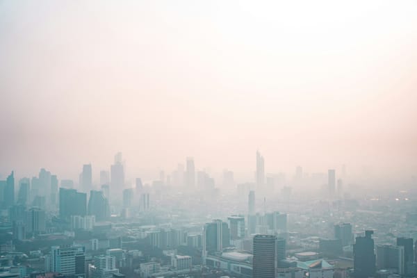 Photo of the skyline of Bangkok, Thailand in smog.