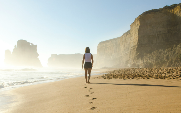 A person walking on the beach